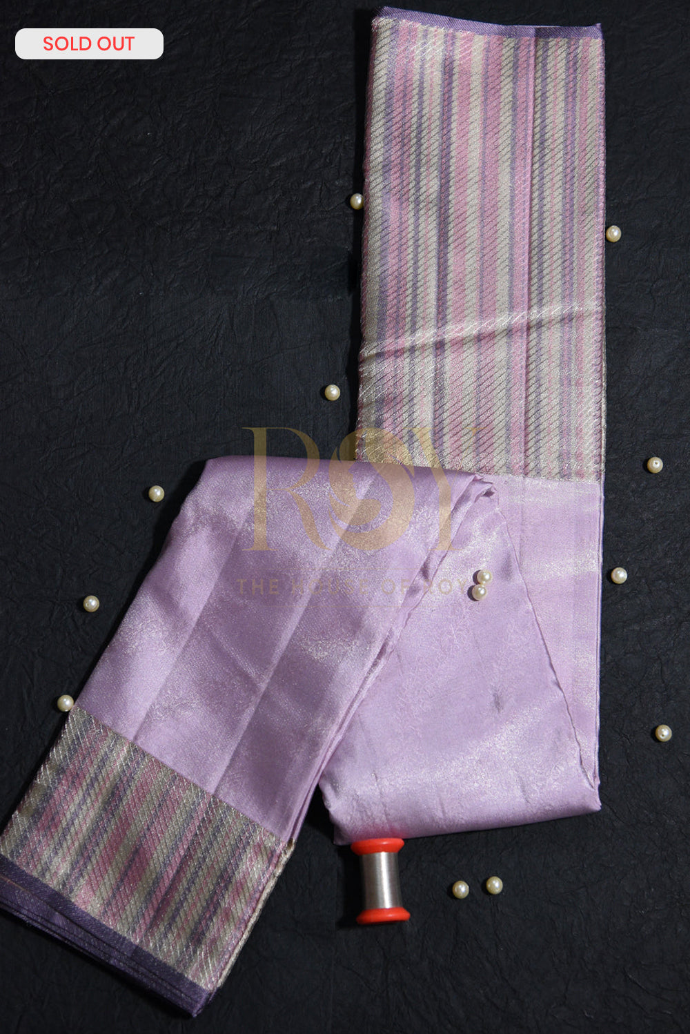 A pale lilac silk saree