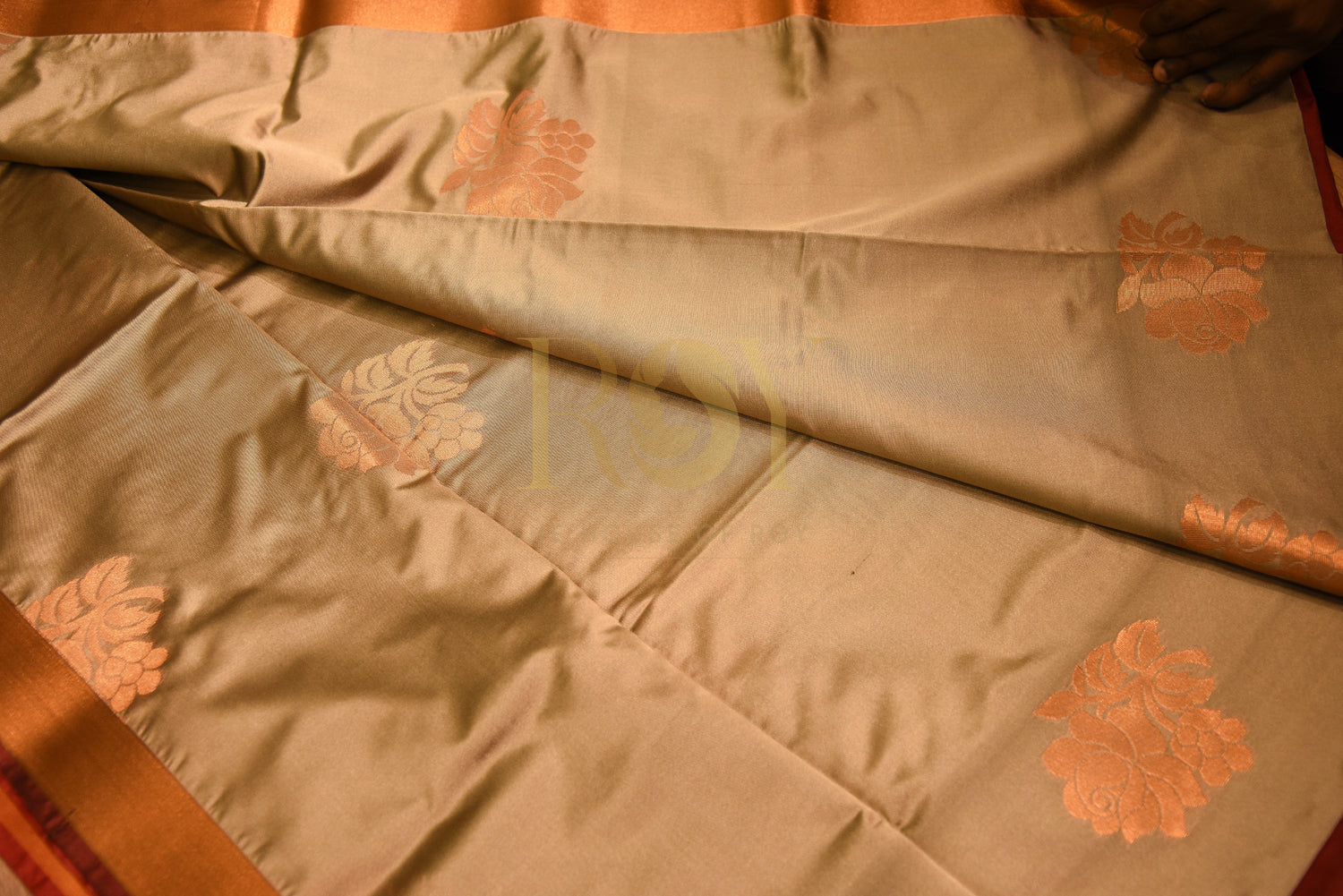 Soft silk saree with fancy floral copper jari champagne