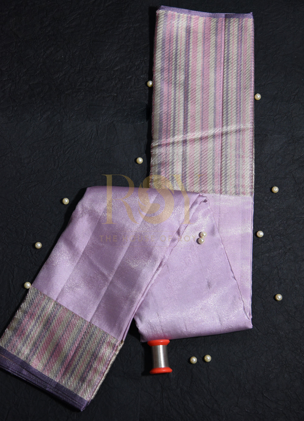 A pale lilac silk saree