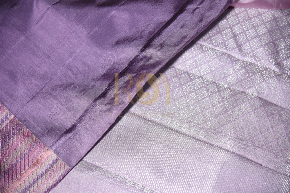 A pale lilac silk saree