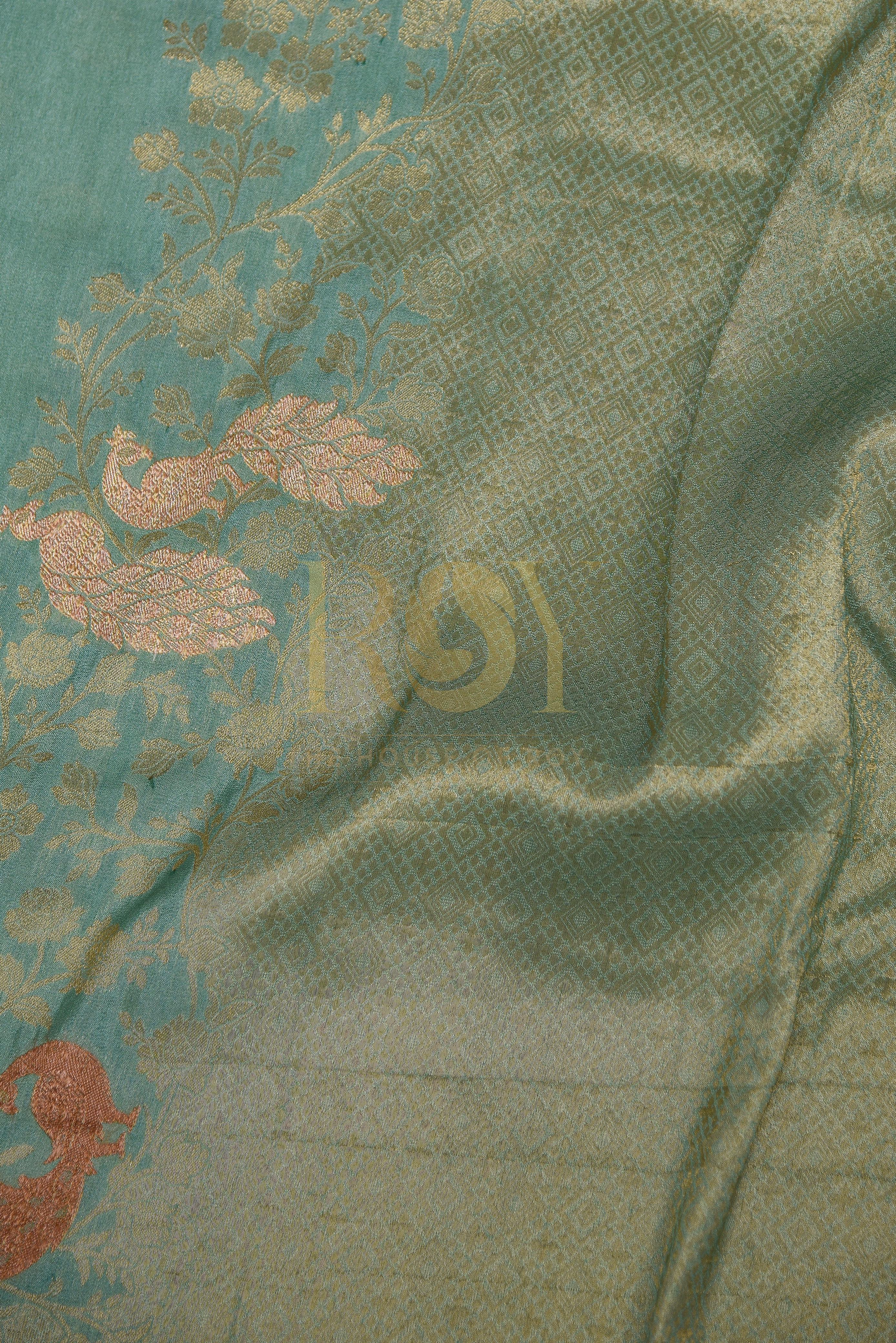 A sage green georgette saree