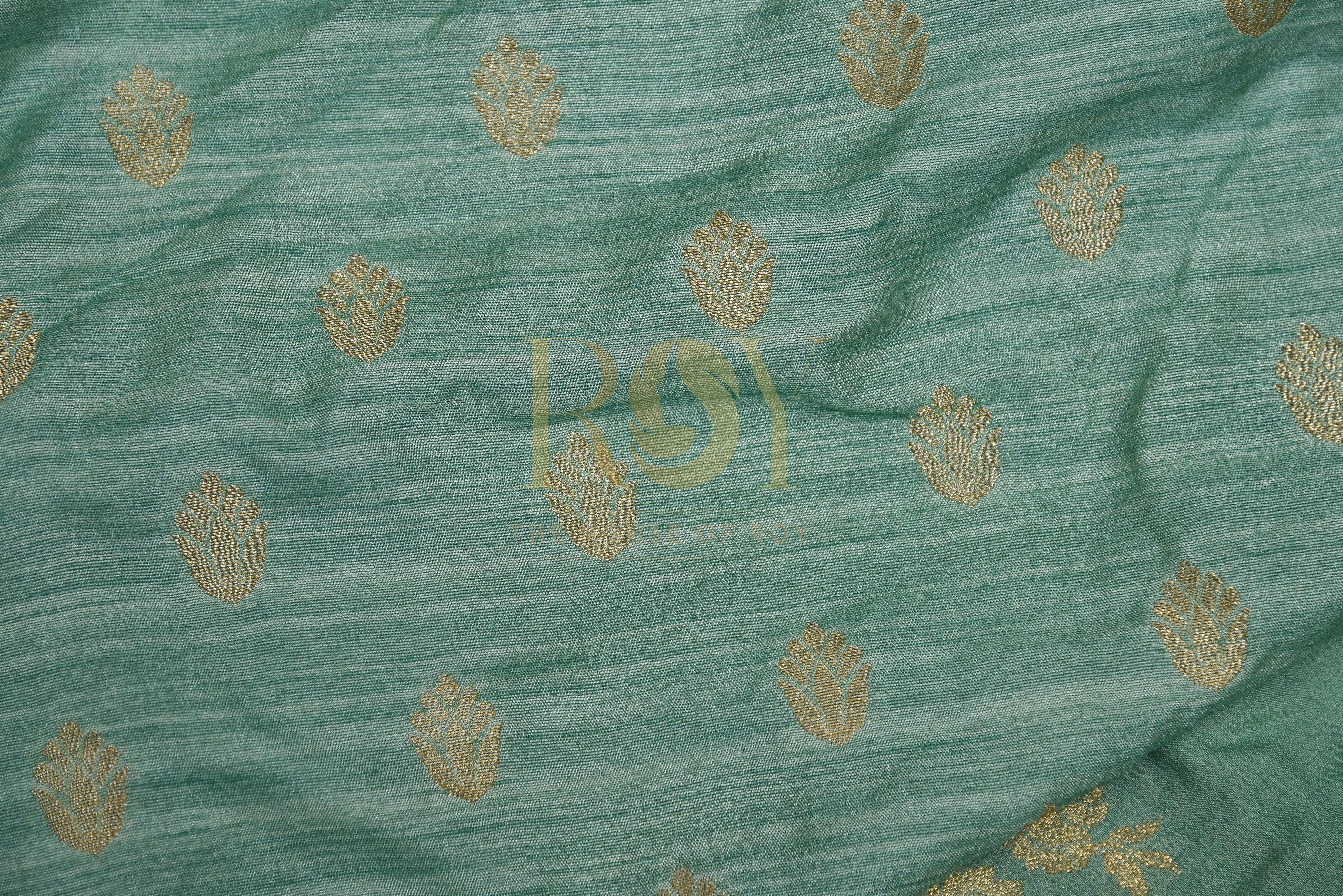 A sage green georgette saree