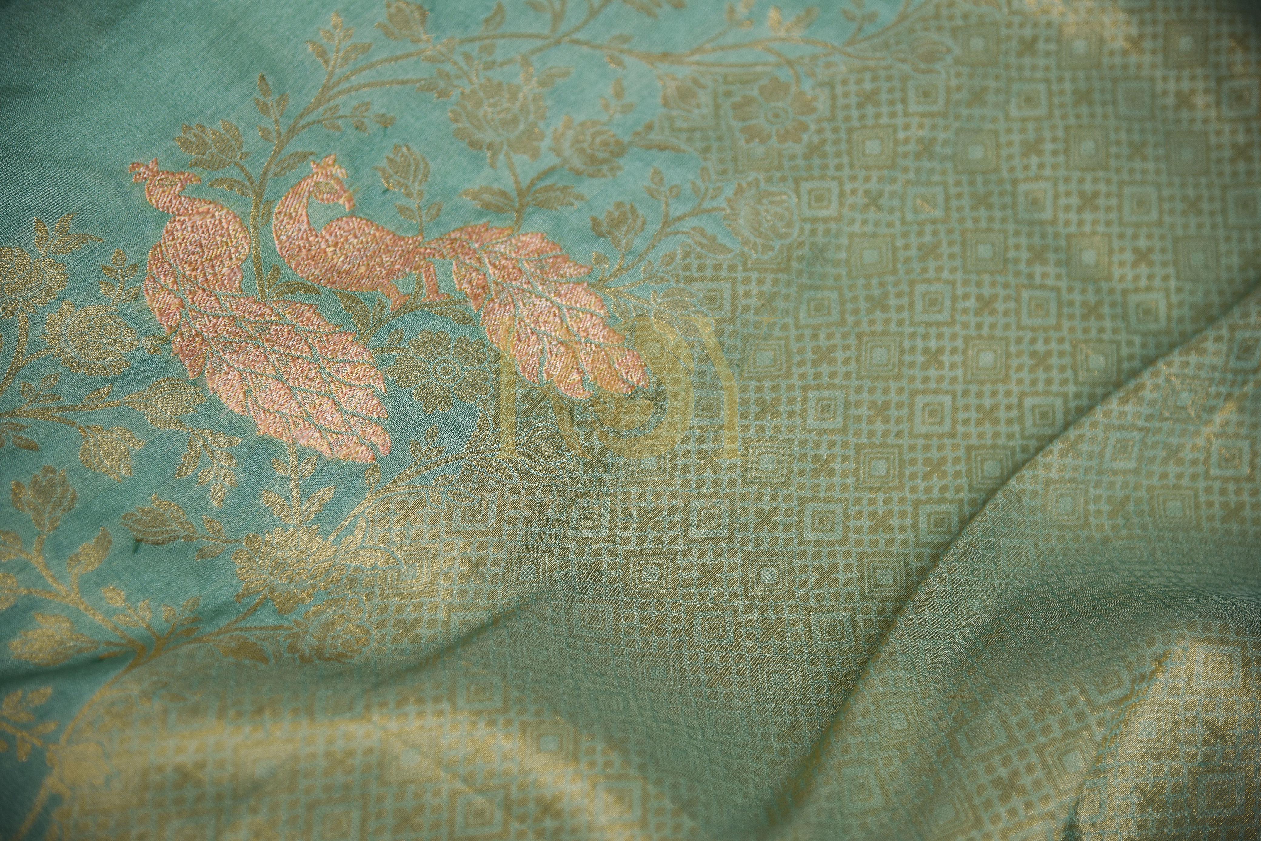 A sage green georgette saree