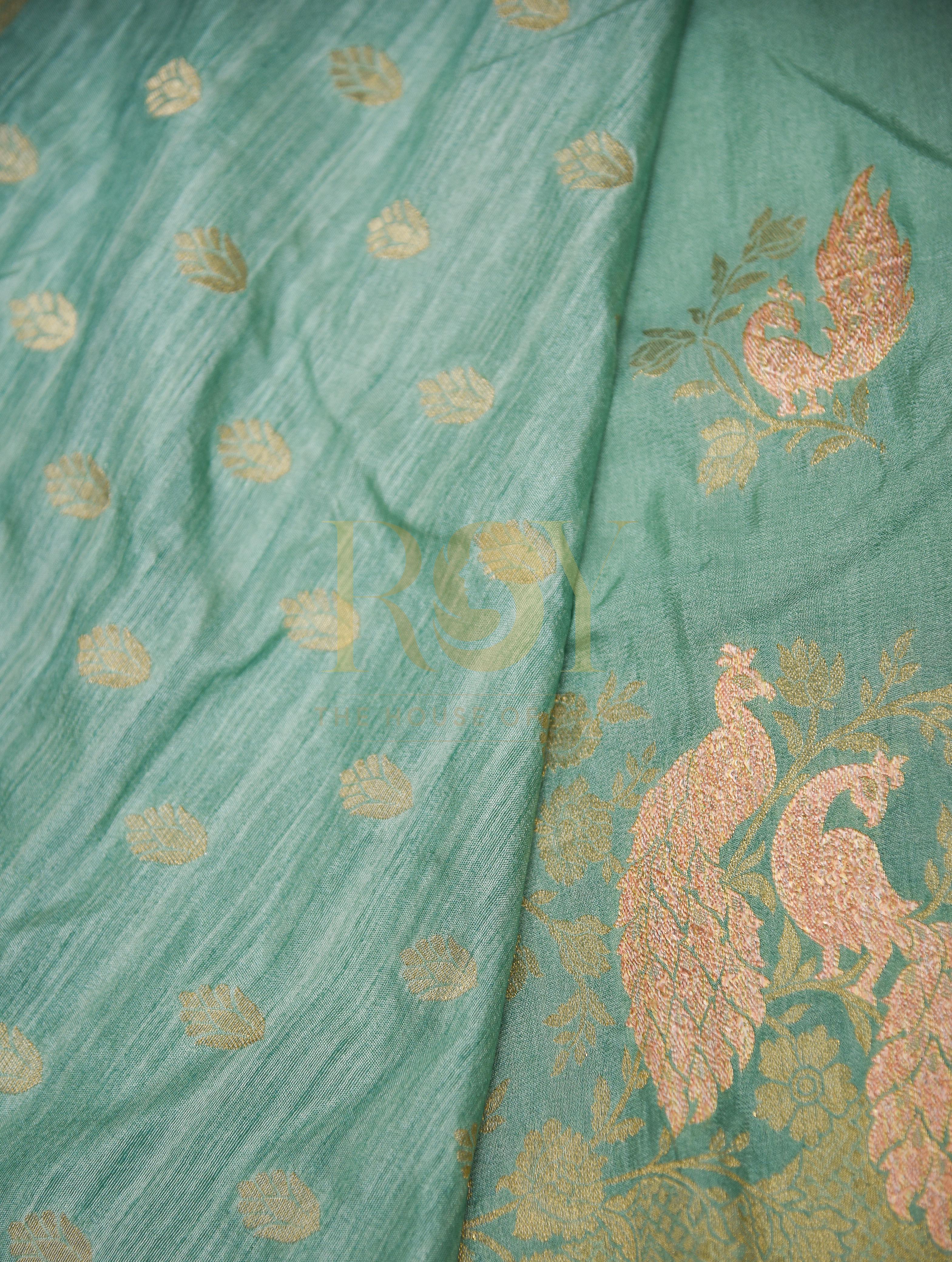 A sage green georgette saree