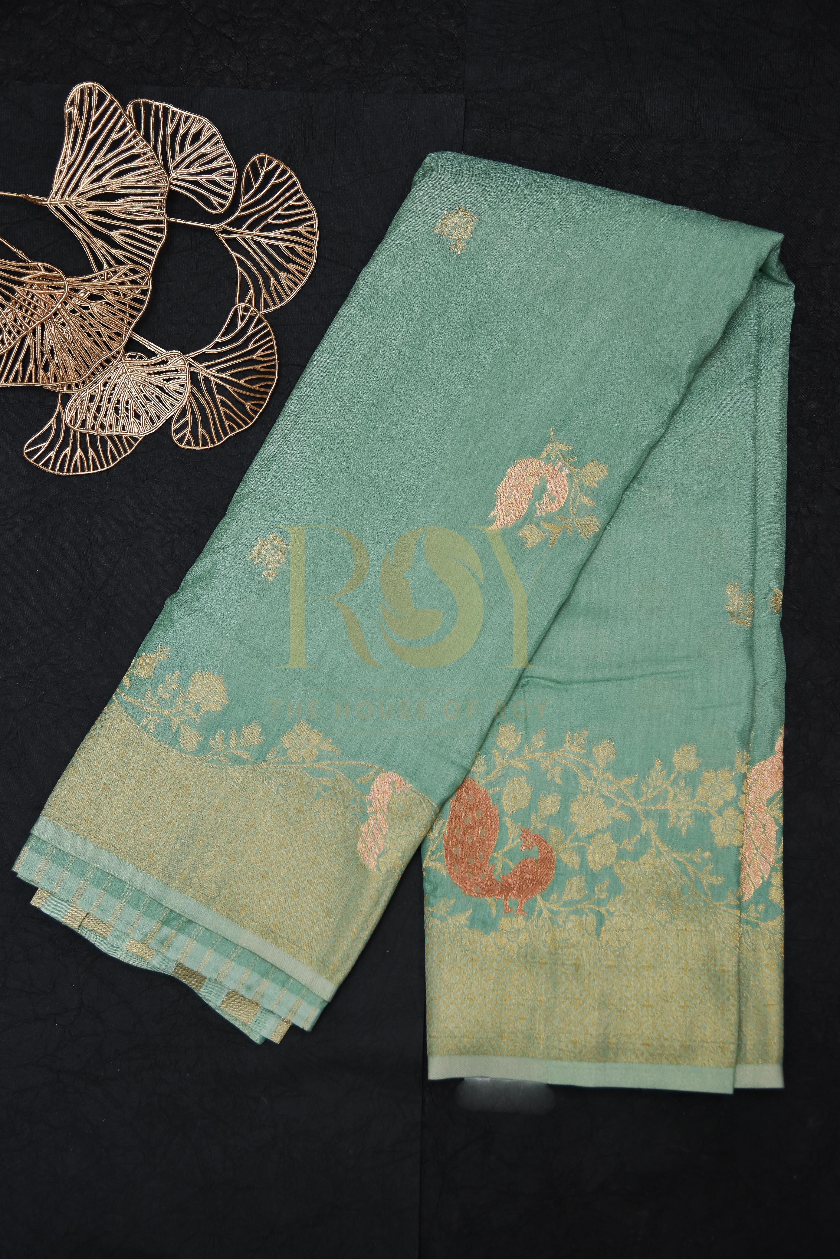 A sage green georgette saree